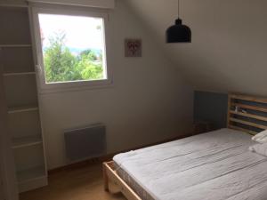 Postel nebo postele na pokoji v ubytování Gite des 3 cigognes