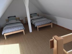 Postel nebo postele na pokoji v ubytování Gite des 3 cigognes