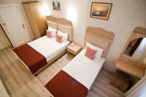 Postel nebo postele na pokoji v ubytování Artefes Hotel Old City