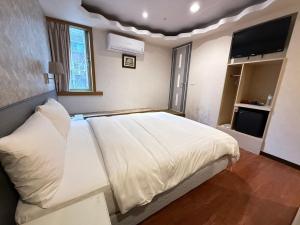 Letto o letti in una camera di 漫旅時光旅店