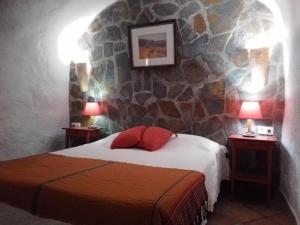 Postel nebo postele na pokoji v ubytování Cuevas Andalucia