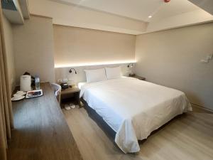 Postel nebo postele na pokoji v ubytování 衿后禾居Good Hotel