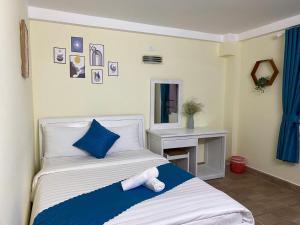 Postel nebo postele na pokoji v ubytování HUY HOANG II Hotel - Da Lat