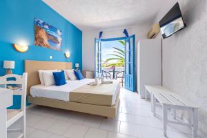 Postel nebo postele na pokoji v ubytování Bluu Bahari Hotel