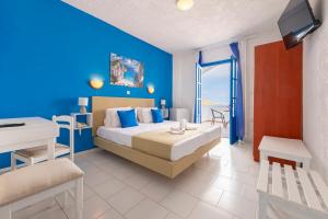 Postel nebo postele na pokoji v ubytování Bluu Bahari Hotel