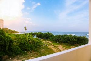 a view of the beach from a balcony at Mirissa Turtle Point Guest in Mirissa