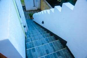 a set of stairs leading to a door at Mirissa Turtle Point Guest in Mirissa