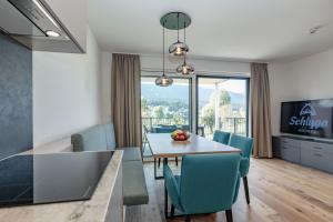 A television and/or entertainment centre at Apartments Schluga