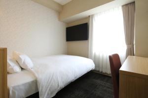 Postel nebo postele na pokoji v ubytování AB Hotel Hikone