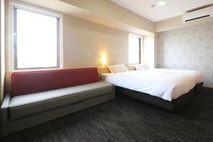 Postel nebo postele na pokoji v ubytování AB Hotel Hikone