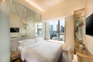 Voodi või voodid majutusasutuse Dorsett Mongkok, Hong Kong toas