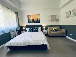 Postel nebo postele na pokoji v ubytování 2-4pax Condo Unit in Subic Bay
