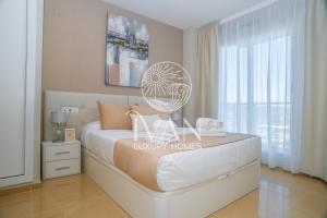 Postel nebo postele na pokoji v ubytování Casa Wesley Ivan Luxury Homes 9ªPlta Norte 1ªLinea + 19 fotografií