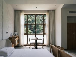 Fotografie z fotogalerie ubytování Xianju What Fun Hotel Shenxianju Scenic Area v destinaci Xianju