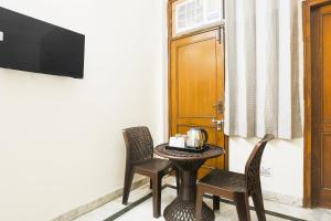 TV a/nebo společenská místnost v ubytování Hotel O JPS DC RESIDENCY