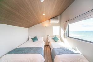Voodi või voodid majutusasutuse Awaji Ocean View in Kusaka toas