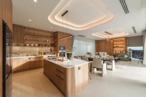 a kitchen and dining room with a dining table at Nature's Rest Private Pool Villa Rawai in Rawai Beach