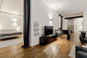 a living room with a piano and a bed at 125qm Loft nahe Stadt und Hafen in Hamburg