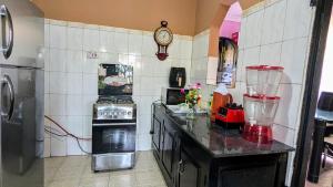 a kitchen with a counter with a blender in it at 3 Bedroom Appartment with Beautiful view of Kilimanjaro Mountain in Moshi +6 photos