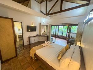 TV a/nebo společenská místnost v ubytování El Nido Coco Resort