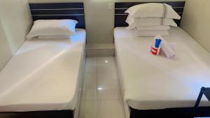 A bed or beds in a room at 金源賓館 Golden Yuan Guest House