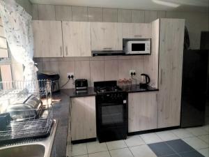 Eldhús eða eldhúskrókur á Just Property Zululand