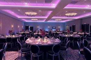 a banquet room with tables and chairs and purple lighting at Courtyard by Marriott Nashville Mount Juliet in Mount Juliet +19 photos
