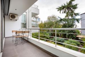 a balcony with a table and chairs on it at NOA - Sungu 1 in Istanbul