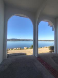 a view of the beach from a building with an archway at Appartement 4 personnes port Leucate in Port Leucate