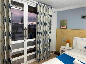 Postel nebo postele na pokoji v ubytování HUY HOANG II Hotel - Da Lat