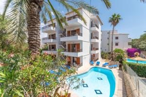 an apartment with a swimming pool and a resort at Gran Sol Family 8 in Felanitx