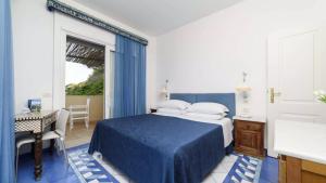 Postel nebo postele na pokoji v ubytování Grand Hotel San Pietro
