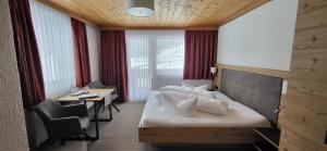 Postel nebo postele na pokoji v ubytování Hotel Gsallbach