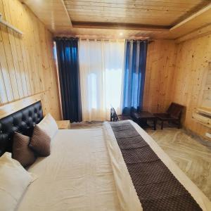 Voodi või voodid majutusasutuse Ekaant Stays - Manali toas