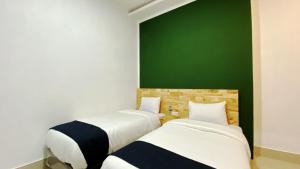 Voodi või voodid majutusasutuse D'Hills Hotel toas