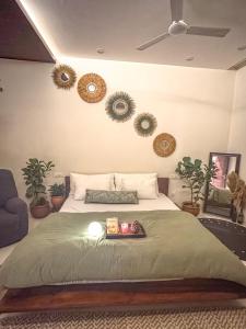 Ένα ή περισσότερα κρεβάτια σε δωμάτιο στο Vamsa Boutique Stay