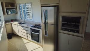 Η κουζίνα ή μικρή κουζίνα στο Apartamento alto padrão no 17º andar com 3 quartos TOP