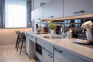 Nhà bếp/bếp nhỏ tại MLOFT Apartments München
