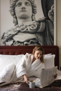Postel nebo postele na pokoji v ubytování Airy Athens Suites