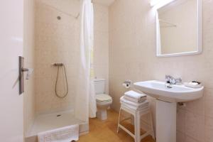 a bathroom with a sink and a toilet and a shower at Hotel Marblau Tossa in Tossa de Mar