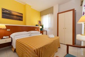 Postel nebo postele na pokoji v ubytování Hotel Galf