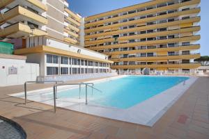 a large swimming pool in front of a building at El Nido de los Ángeles in Playa del Ingles