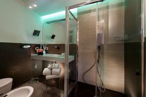 Ett badrum på Argentina Residenza Style Hotel