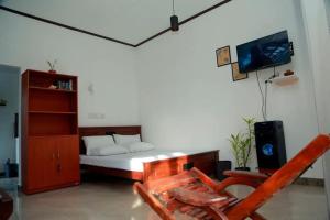 Μια τηλεόραση ή/και κέντρο ψυχαγωγίας στο Ruwi Home Stay