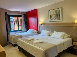 Cama ou camas em um quarto em Hotel Fioreze Origem