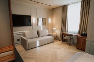 TV a/nebo společenská místnost v ubytování Parc Suites by Hotel Cerbul