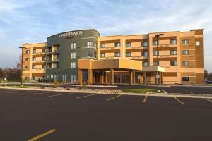 an empty parking lot in front of a hotel at Courtyard by Marriott Battle Creek in Battle Creek