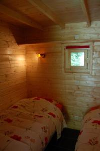 Giường trong phòng chung tại Ascou la Forge
