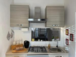Η κουζίνα ή μικρή κουζίνα στο Spacious apartment in Manciano with view