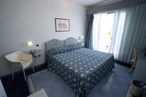 Postel nebo postele na pokoji v ubytování Hotel Santa Caterina + 23 fotografií